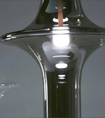 Close-up of a modern glass chair with reflective surface