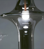 Close-up of a modern glass chair with reflective surface