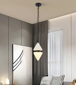 Modern pendant light hanging in a room with neutral walls and decor.