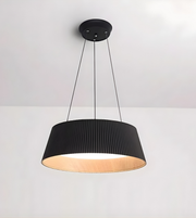 Black pendant light with a ribbed shade on a white background