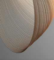 Close-up of a curved metallic surface with concentric circular patterns on a gray background