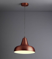 Bronze pendant light hanging against a gray background