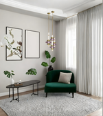 Modern living room with a green sofa, coffee table, and decorative elements.