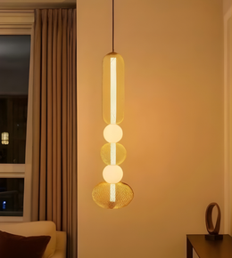 Modern pendant light hanging in a room with a window and curtain.