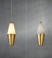 Modern pendant light with gold and white design on a gray background