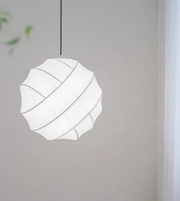 Modern pendant light with geometric design on a neutral background