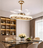 Luxury oval crystal fan chandelier with gold finish installed above a modern dining table