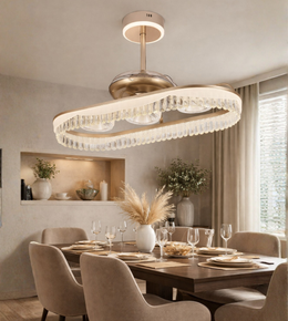 Luxury wave crystal fan chandelier with gold finish installed above a modern dining table