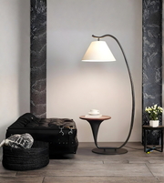 Modern arc floor lamp with built-in side table in contemporary living room