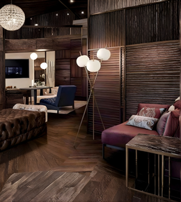 Modern tripod floor lamp with three white glass globe lights in luxury living room