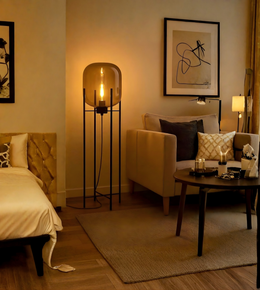 Amber glass dome floor lamp illuminating a cozy modern living room