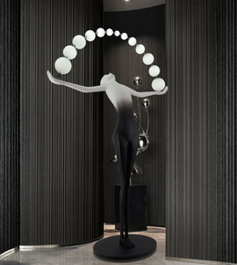 Modern sculptural floor lamp with human figure design and curved globe lights for luxury interior décor
