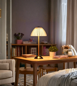Modern bedside lamp glowing in cozy bedroom
