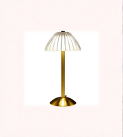 Minimal gold bedside table lamp on white surface