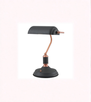 Matte black banker desk lamp with copper accents on white background