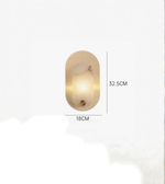 Modern oval wall lamp with warm ambient lighting and compact dimensions