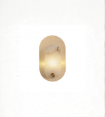 Oval gold wall sconce with perforated metal frame on white background