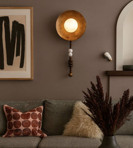 Modern artisan disc wall light in cozy contemporary living room