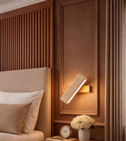 Minimal geometric wall light in luxury bedroom interior