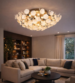 Luxury floral glass ceiling chandelier with gold finish illuminating modern living room with warm ambient lighting