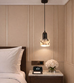 mini marble pendant light with black top hanging beside bed, warm ambient lighting for modern bedroom