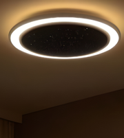 Ceiling light fixture with a starry sky design on a ceiling