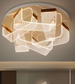 Modern ceiling light fixture with geometric design on a neutral background