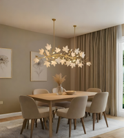 Dining room with a floral chandelier, wooden table, and beige chairs.