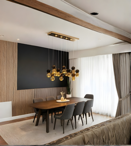 Modern dining room with a chandelier, wooden table, and gray chairs.
