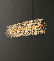 Decorative ceiling light fixture with gold accents on a dark background