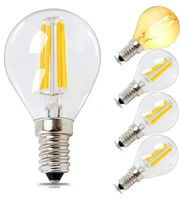 Clear LED light bulb with visible filaments and base, shown from multiple angles on a white background.
