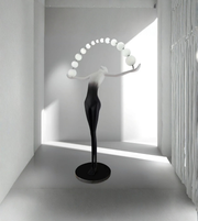 Modern floor lamp with spherical design in a minimalistic room