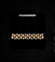 Modern pendant light fixture with glass cover on a black background