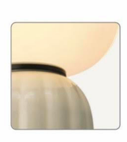 Wall-mounted light fixture with a beige shade on a white background