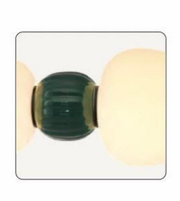 Close-up of a green and gold object on a white background