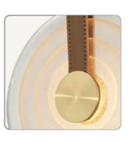 Decorative wall light fixture with gold finish and white background