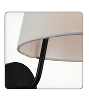 Close-up of a lamp with a beige shade and black base on a white background