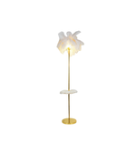 White floor lamp with gold base on a white background