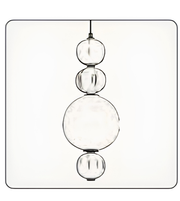 Modern pendant light with three spherical glass shades on a white background