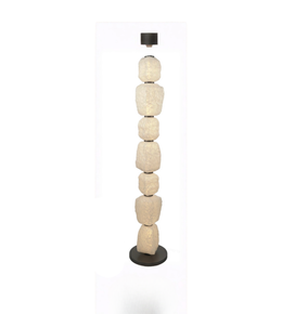 Decorative floor lamp with stacked stone-like design on a white background