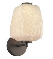 Wall-mounted light fixture with textured glass shade on a white background