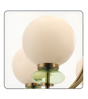 Decorative wall light fixture with spherical glass shades on a white background