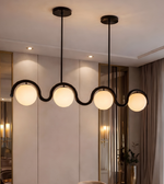 Modern chandelier with glass shades in a room setting