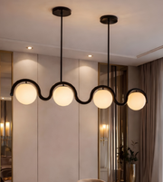 Modern chandelier with glass shades in a room setting