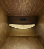 Stairwell with wooden walls and a stone step
