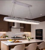 Modern kitchen with a long pendant light fixture.