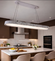 Modern kitchen with a long pendant light fixture.