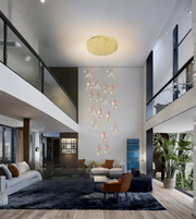 Modern living room with a chandelier, sofa, and decorative elements.