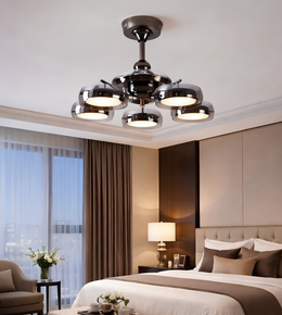 Modern bedroom with a ceiling light fixture, bed, and decor.
