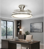 Ceiling fan light fixture in a modern office setting with a desk and bookshelf.